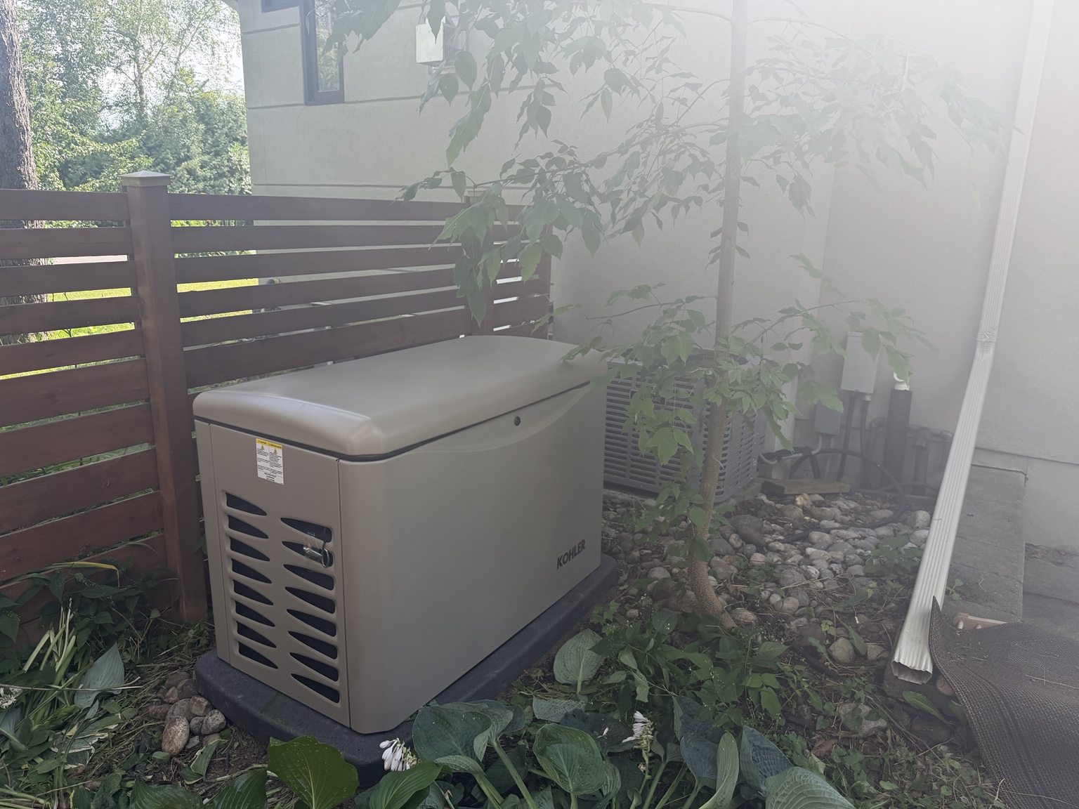 Kohler standby generator installed beside a residence