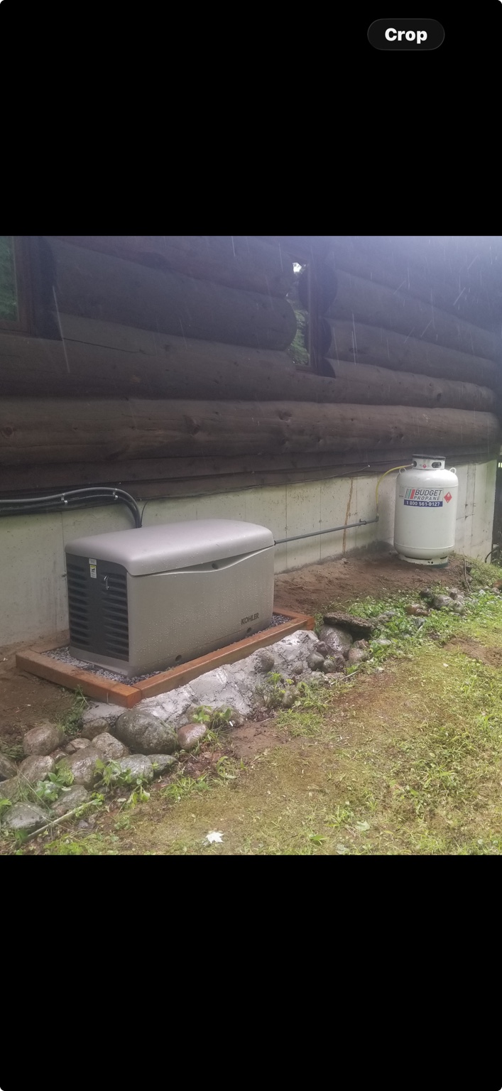 Residential standby generator connected near a propane tank